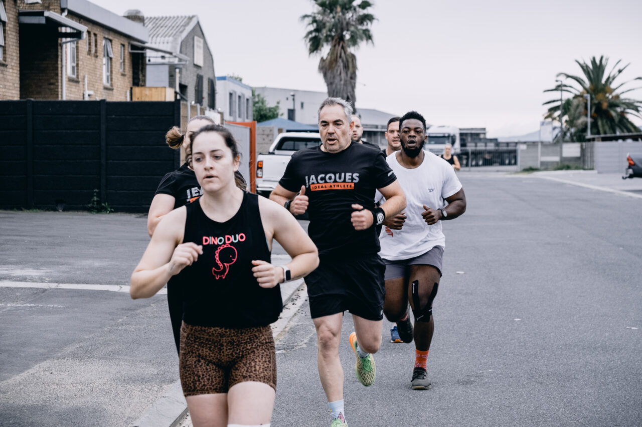 Members running outdoors during a group training session at IP Fitness in Okavango Park, Brackenfell